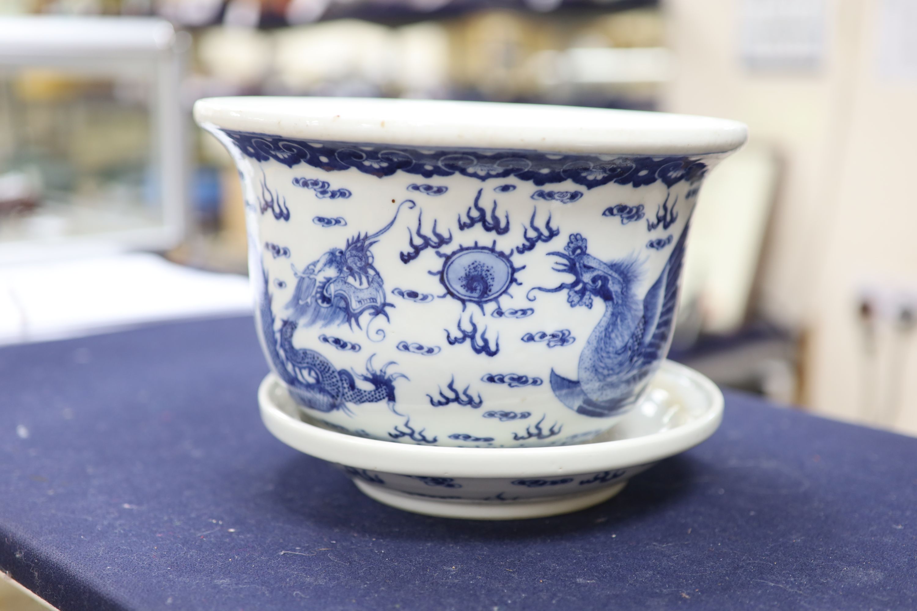 A 19th century Chinese porcelain jardiniere on stand